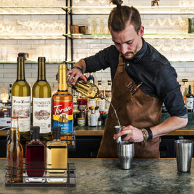 Countertop syrup storage that keeps bar essentials neatly organized.
