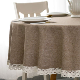 EHouseHome faux linen tablecloth with lace trim on round 70-inch table, elegant centerpiece.