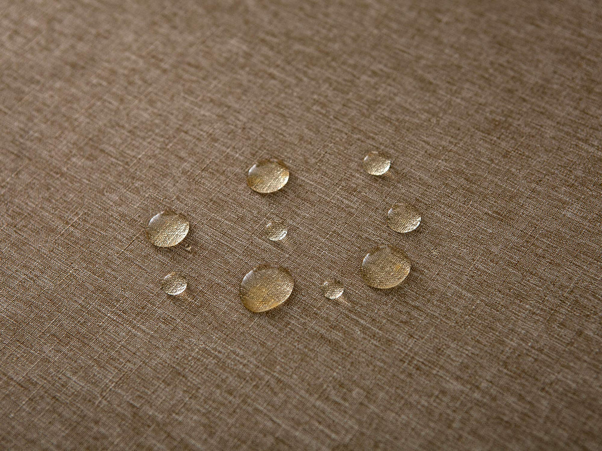 Wrinkle-free fabric laid flat on a round table for quick setup.