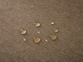 Wrinkle-free fabric laid flat on a round table for quick setup.