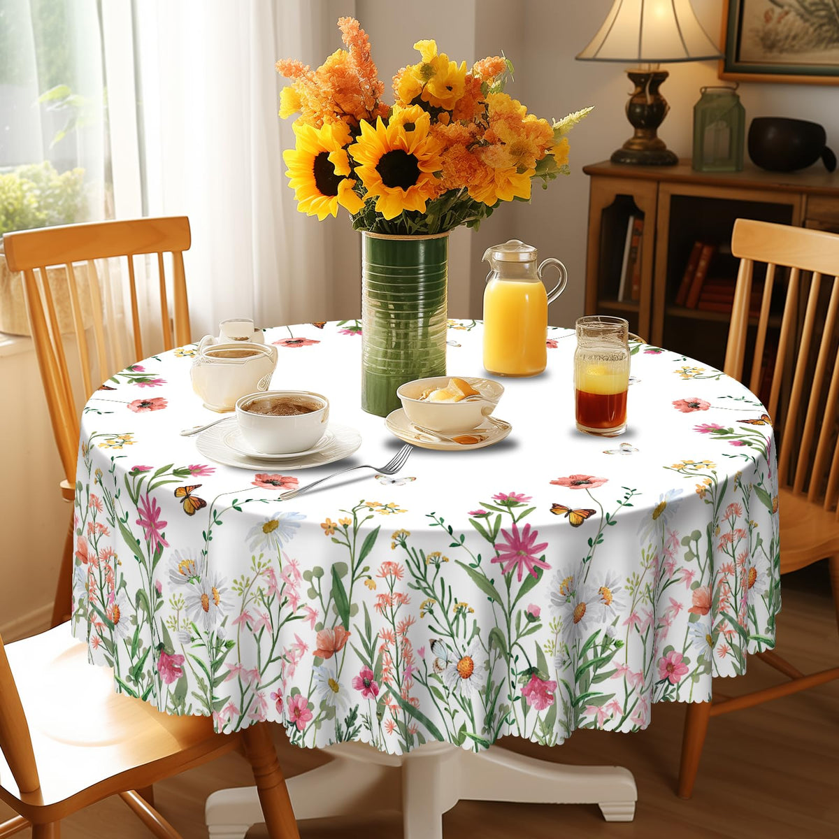 Eikione polyester fabric round tablecloth offers waterproof protection during meals.