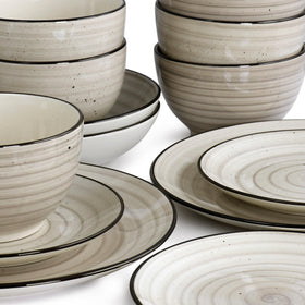 Elama Gia hand-painted swirl and speckle detailing adds charm to table