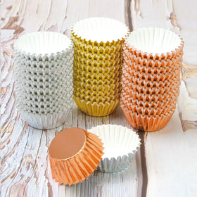 Elcoho cupcakes lined with gold liners ready for easy baking and serving