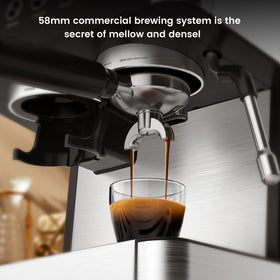 Electactic espresso machine grind-path view showing upgraded ejector for cleaner grounds.
