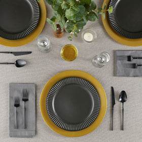 Elegant Disposables gold charger close-up showing durable plastic and premium shine.