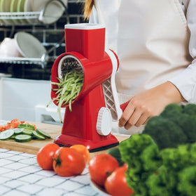 Eleko Meyar grater in red shown in a versatile kitchen setup for toppings and more