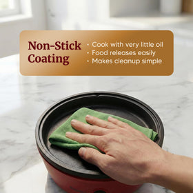 Elite Gourmet EGL-6101 tempered glass lid with steam vent enables controlled cooking.
