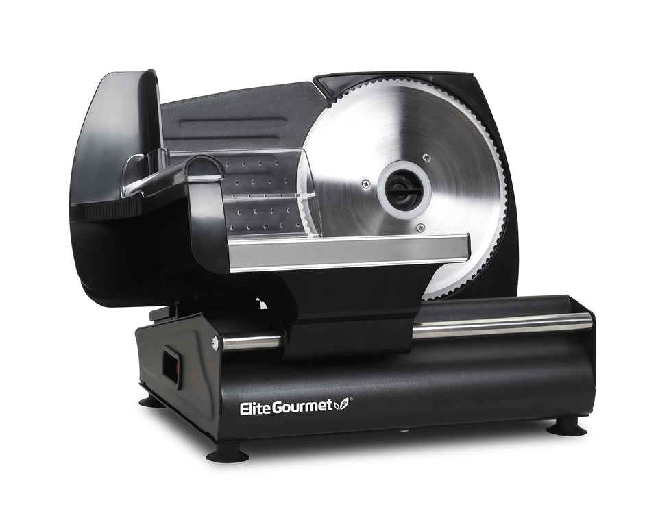 Elite Gourmet EMT-625B slicer on kitchen counter showing precision cutting for thin deli slices.