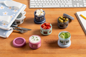 Ello screw-on leak-proof lids seal dressings and sauces securely