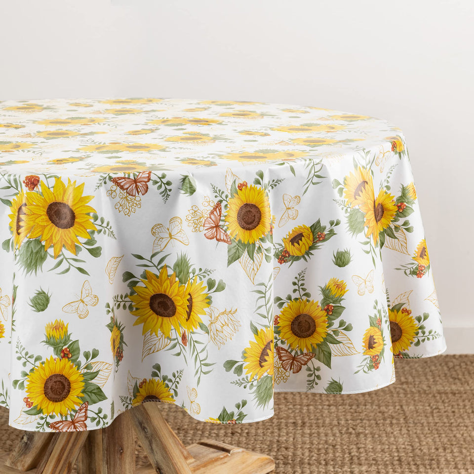Elrene Sunflower Season vinyl tablecloth in oval protects surfaces during outdoor meals.
