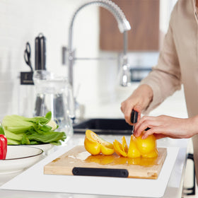 Emolife silicone mat under air fryer keeps countertop clean.
