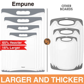Empune cutting boards with juice grooves, close-up, helps catch liquids and keep counters clean.