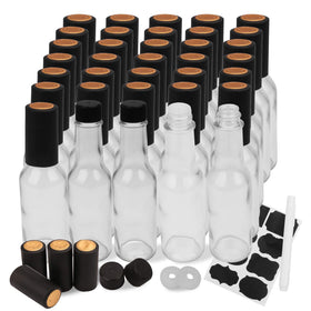 Encheng 5oz bottle with lid, clear glass for easy sauce visibility.