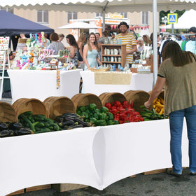 Enjoyidea elastic leg pockets keep the cover securely in place during busy vendor booths.