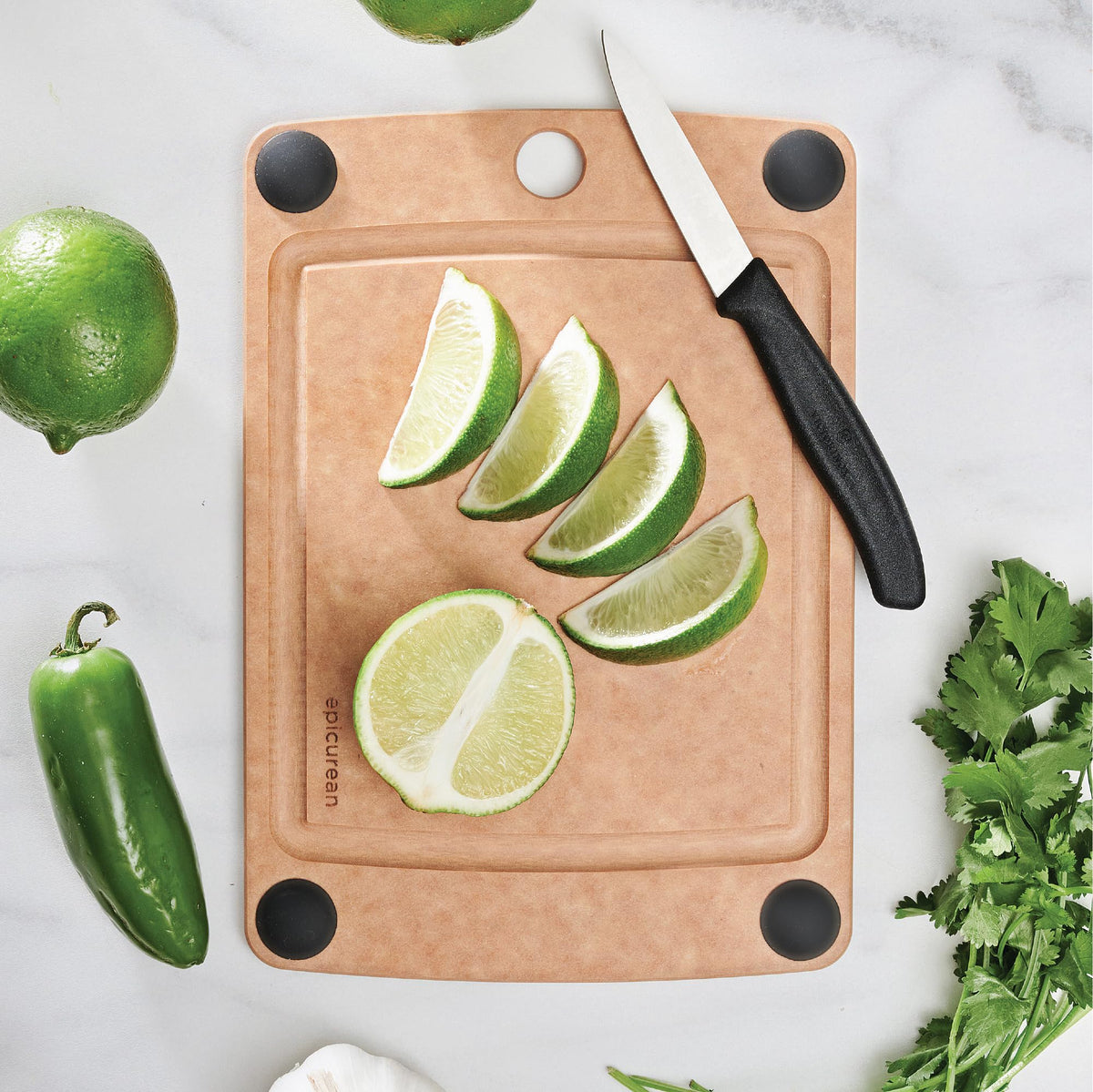 Epicurean All-In-One Cutting Board shows non-slip feet for stable slicing on any counter.