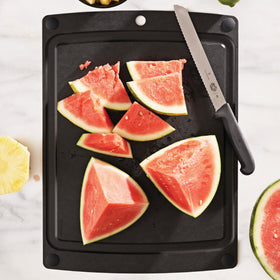 Epicurean All-In-One Cutting Board showing stable non-slip feet on the counter.