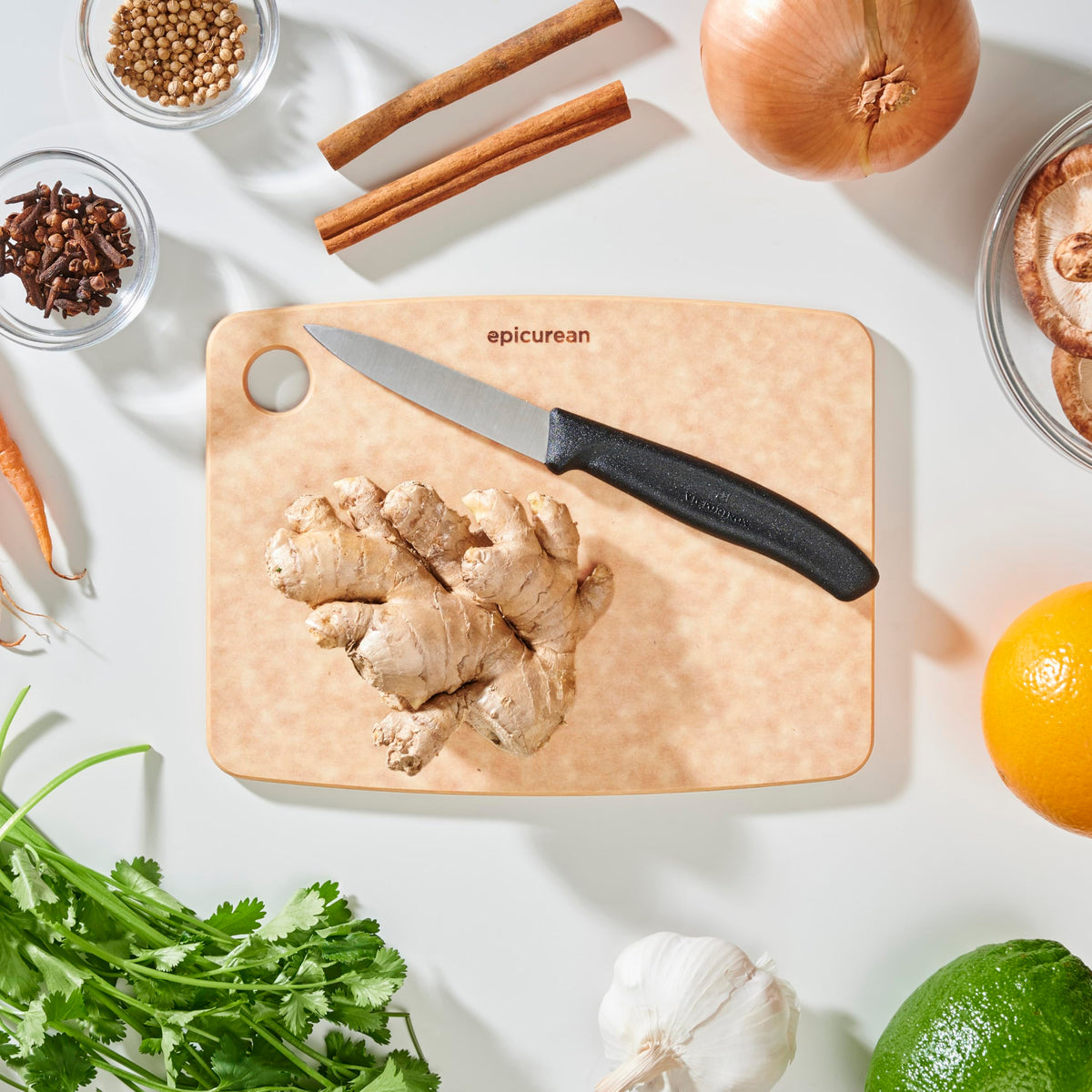 Epicurean board with built-in thumb hole for easy grabbing and storage