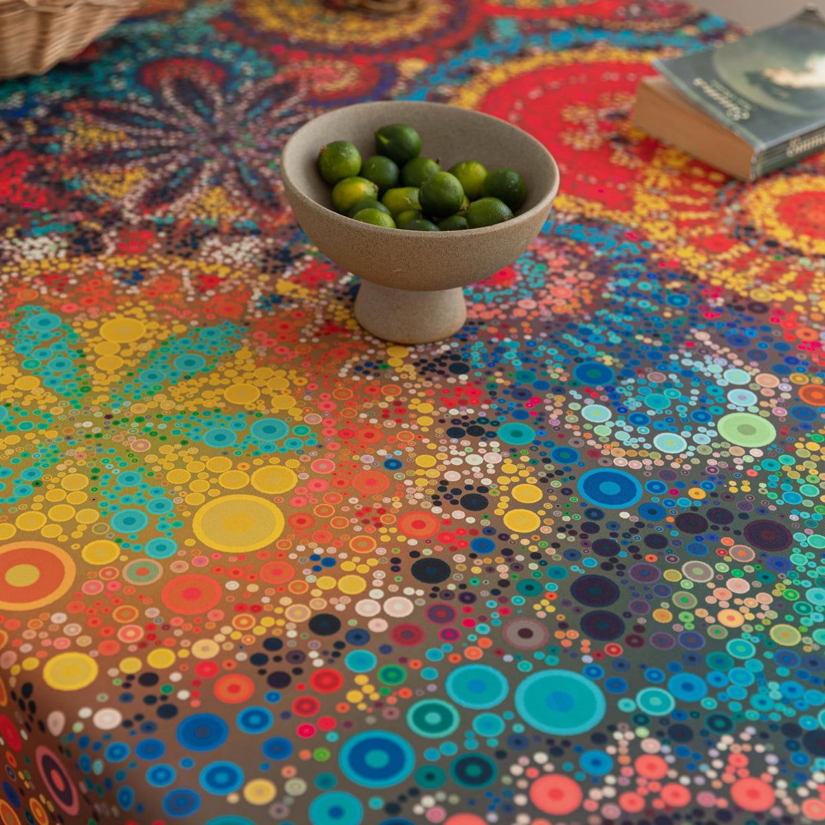 Square-table dining setup featuring Erbnaryx tablecloth with easy care