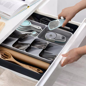Esie Houzie collapsible measuring cups stack neatly for space-saving storage.