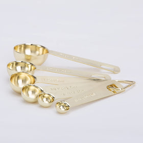 Esie Houzie gold measuring spoons 1/2 tablespoon balanced weight for comfortable use.