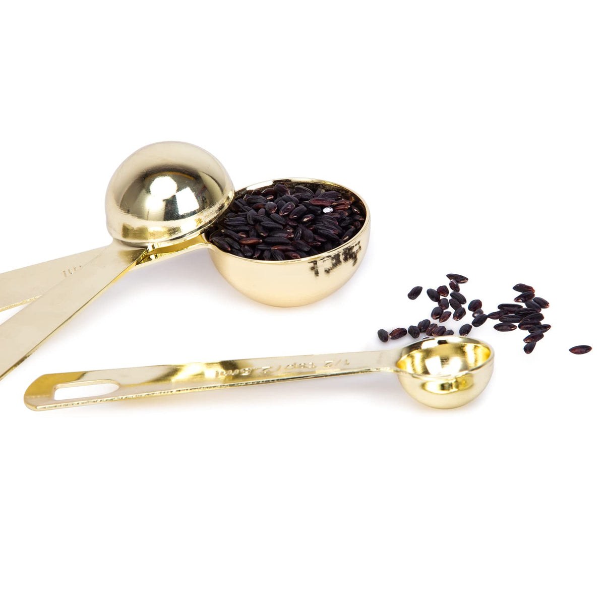 Esie Houzie gold measuring spoons 1/2 teaspoon with rounded head to prevent spills.