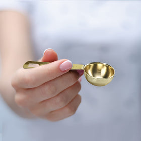 Esie Houzie gold measuring spoons 1 tablespoon durable stainless steel finish.