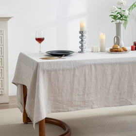 EVERLY linen tablecloth being machine washed demonstrates easy care.