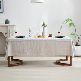 EVERLY linen tablecloth draped over a rectangular table for elegant drop.