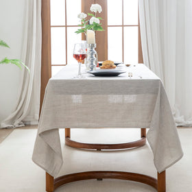 EVERLY linen tablecloth with Halloween decor creates seasonal dining ambience.