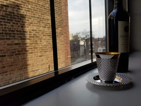 Exquisite 3D floral exterior Kiddush cups paired with matching saucers for Shabbat and weddings.