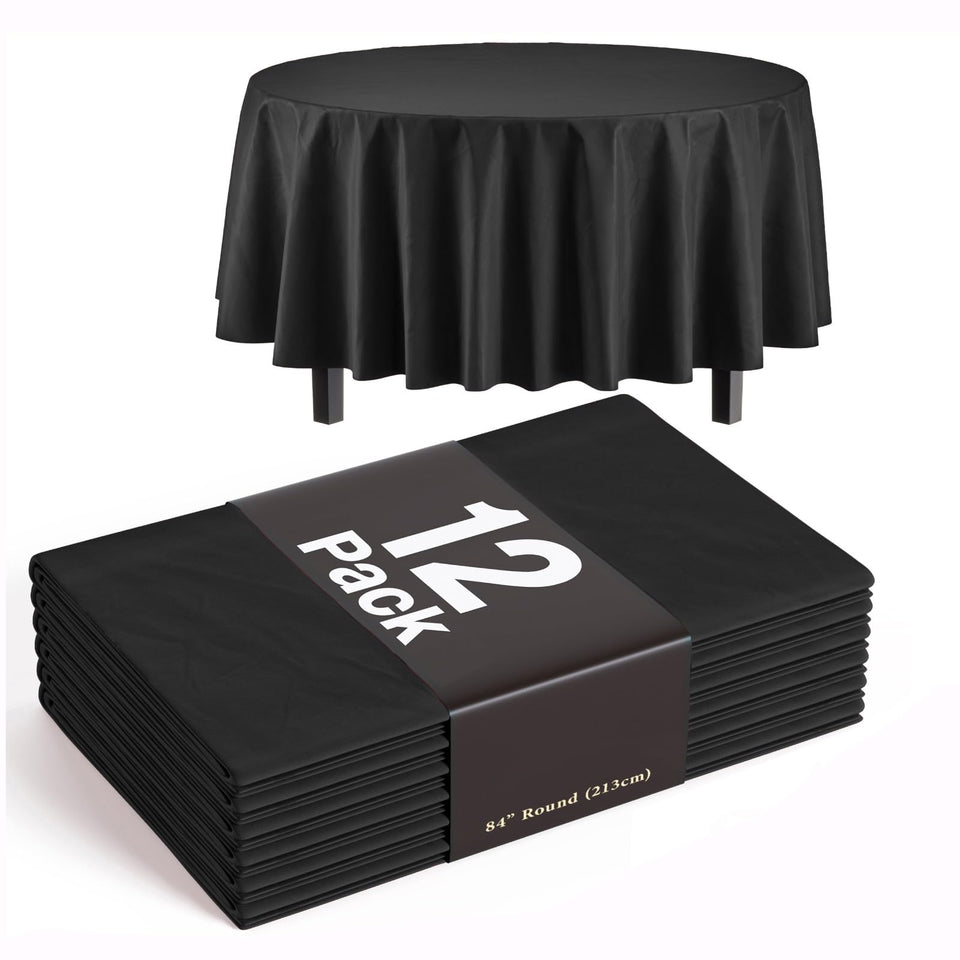 Exquisite 84-inch round black tablecloth laid flat for spill protection.