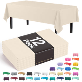 Exquisite ivory 54x108 rectangle tablecloth protecting a long dining table