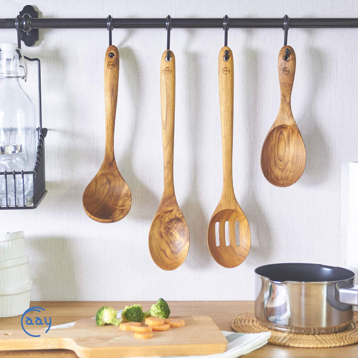 FAAY Teak Ladle hanging to dry after washing for easy maintenance.
