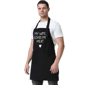 Fairy's Gift wearer grilling in the kitchen while wearing the apron
