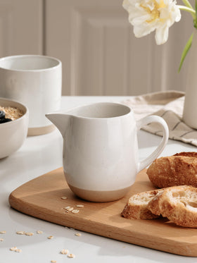 Famiware Milkyway ceramic pitcher close-up shows a sleek spill-free pour.