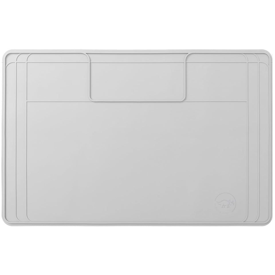 Famous Dino under-sink mat flat lay protects cabinets from leaks and spills