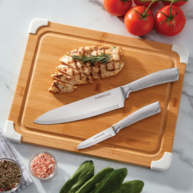 Farberware 11x14 cutting board on a countertop for mid-size tasks