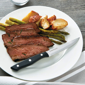 Farberware high-carbon stainless steel edge supports durability and clean slicing.