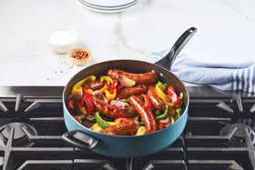 Farberware jumbo cooker helper handle enables secure lifting.