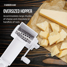 Hard cheese grated by Farberware rotary grater with stainless drum.