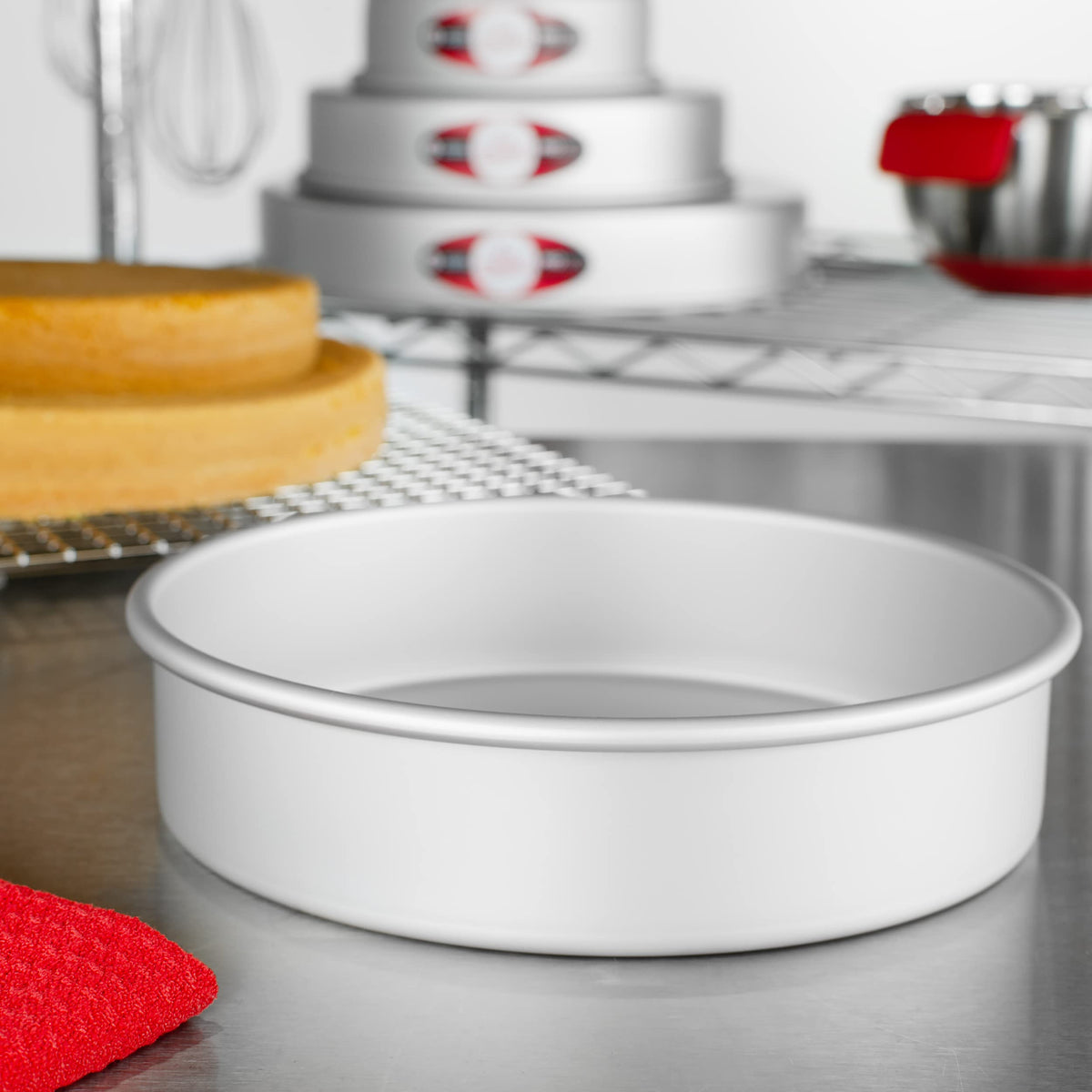 Fat Daddio's cake pan dimensions label shows 8x2 inch size for planning.