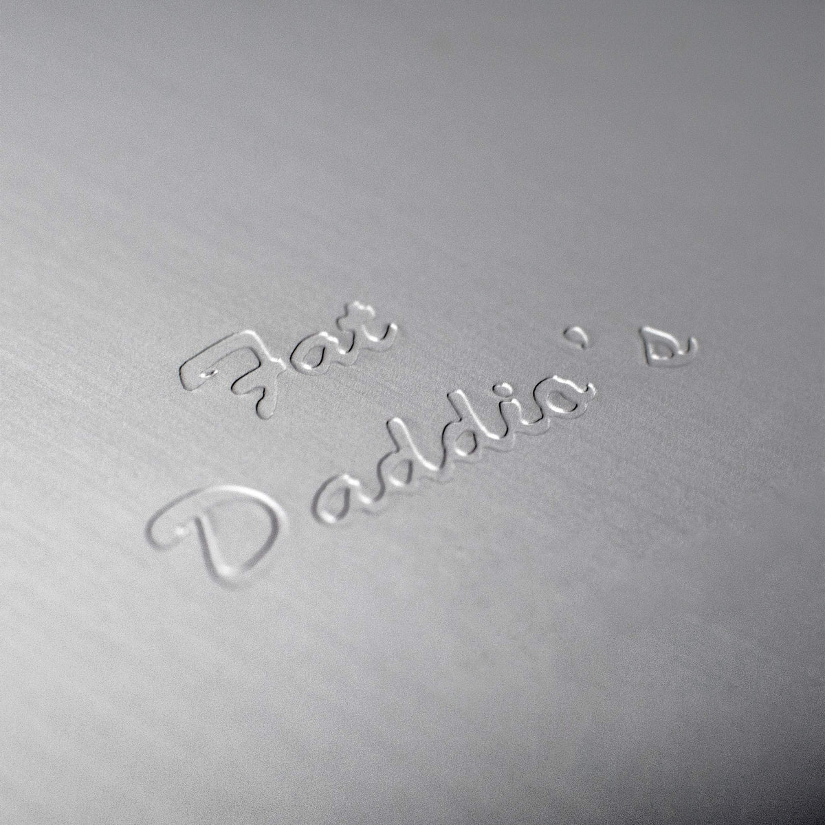Fat Daddio's anodized round cake pan clean-up highlight for easy hand-wash care.