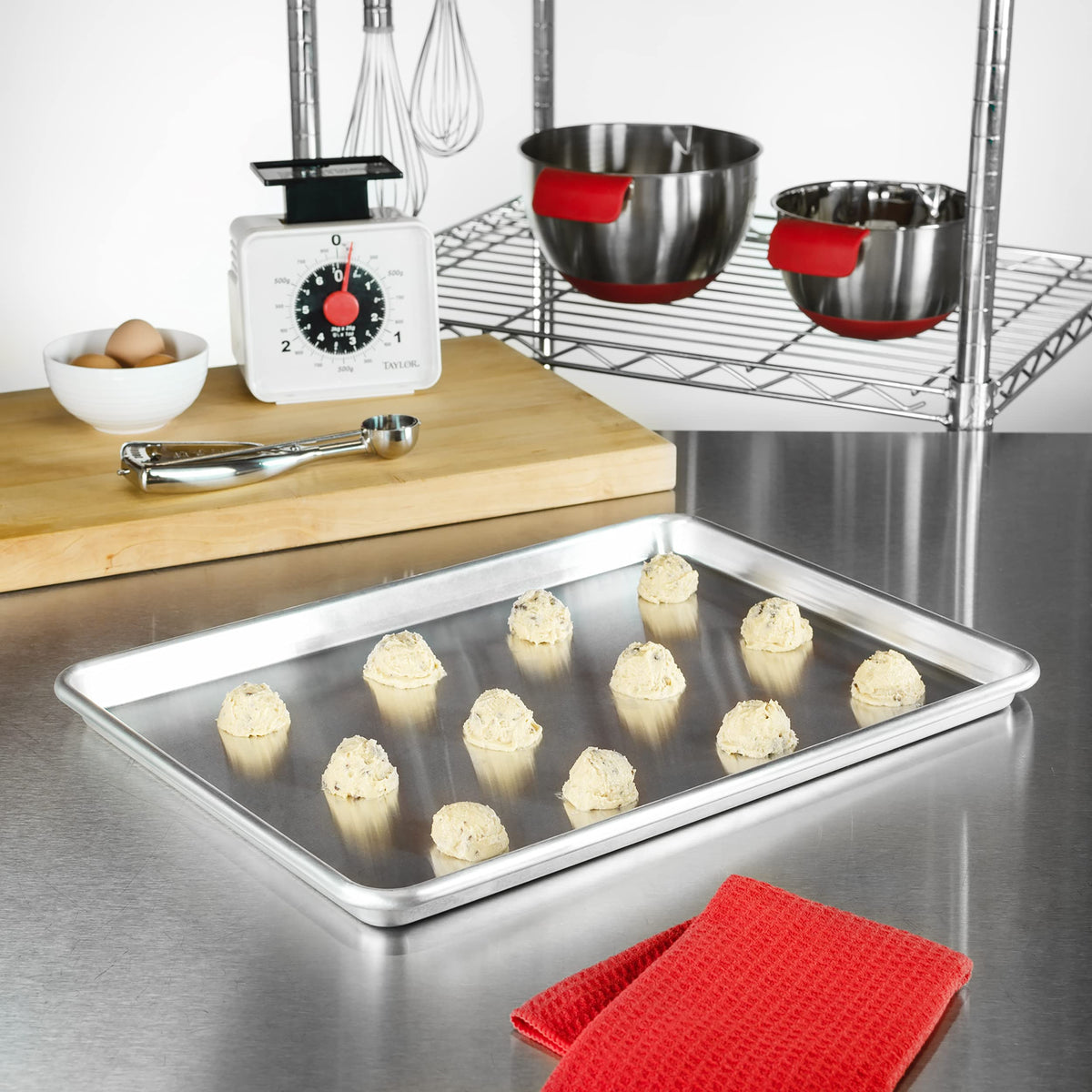 Fat Daddio's half-sheet pan 2-pack edge close-up showing the wire-reinforced rim.