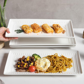 Feenmai embossed rectangular platters add a refined touch to any table.