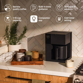 Fellow Aiden coffee maker with brew basket and single-serve option for flexible cups.