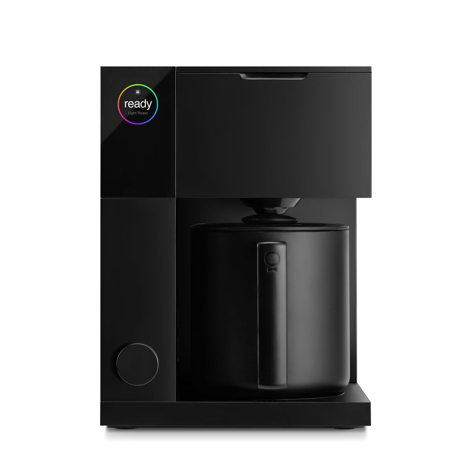 Fellow Aiden Precision Coffee Maker front view with matte black finish on the countertop.