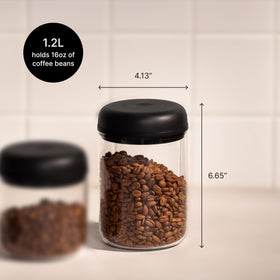 Matte black Atmos canister on counter adds modern style.