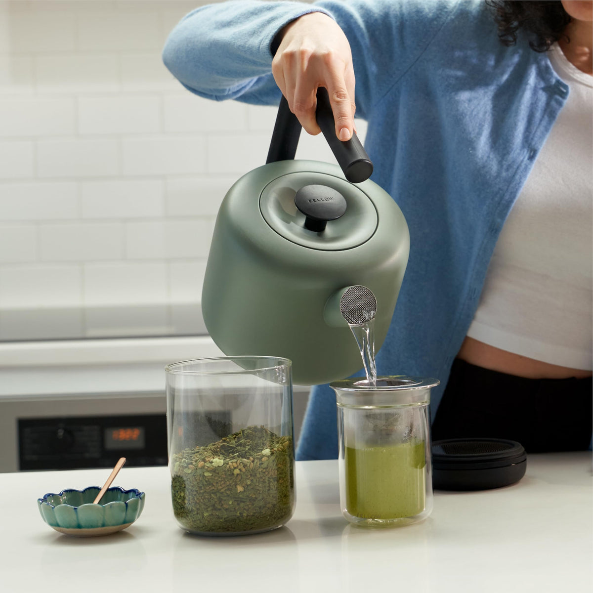 Fellow Clyde Electric Kettle in smoke green finish adds visual appeal.