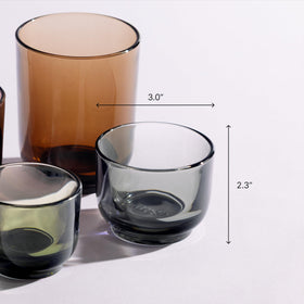 Fellow Pirch cortado glass amber gradient catching light during a drink.