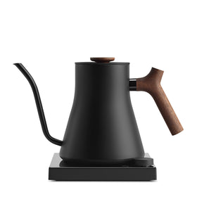 Fellow Stagg EKG Pro Studio Edition with matte black finish and walnut handle for precise, controlled pours.